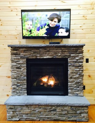 Rock fireplace and TV